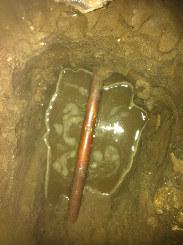 Slab leak that developed from a broken copper pipe