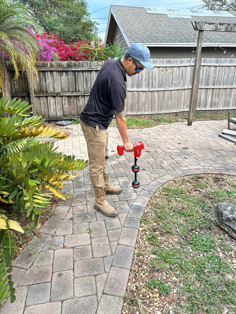 Sonny with I Find Leaks locating a ridgid sewer camera underground for a pool installation.