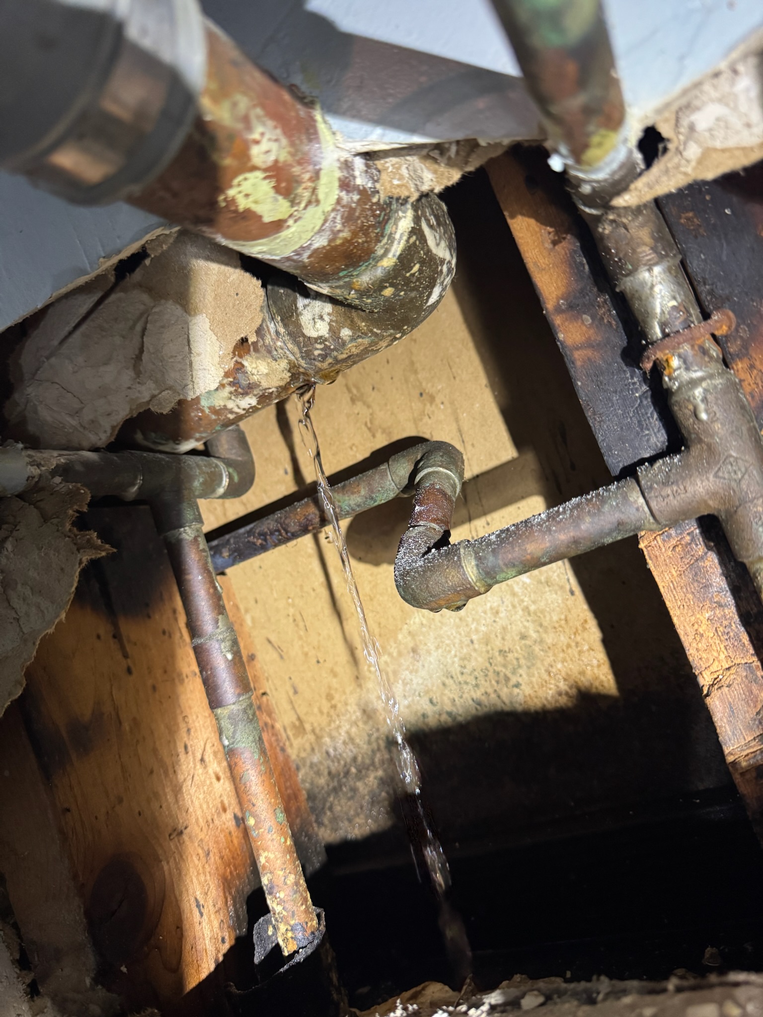A water leak on a copper waste arm in St Petersburg.