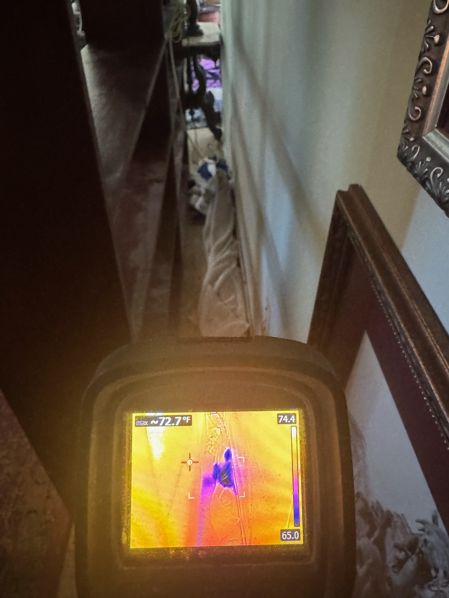 A Flir infrared camera inspecting wet walls in St Petersburg to look for a water leak.