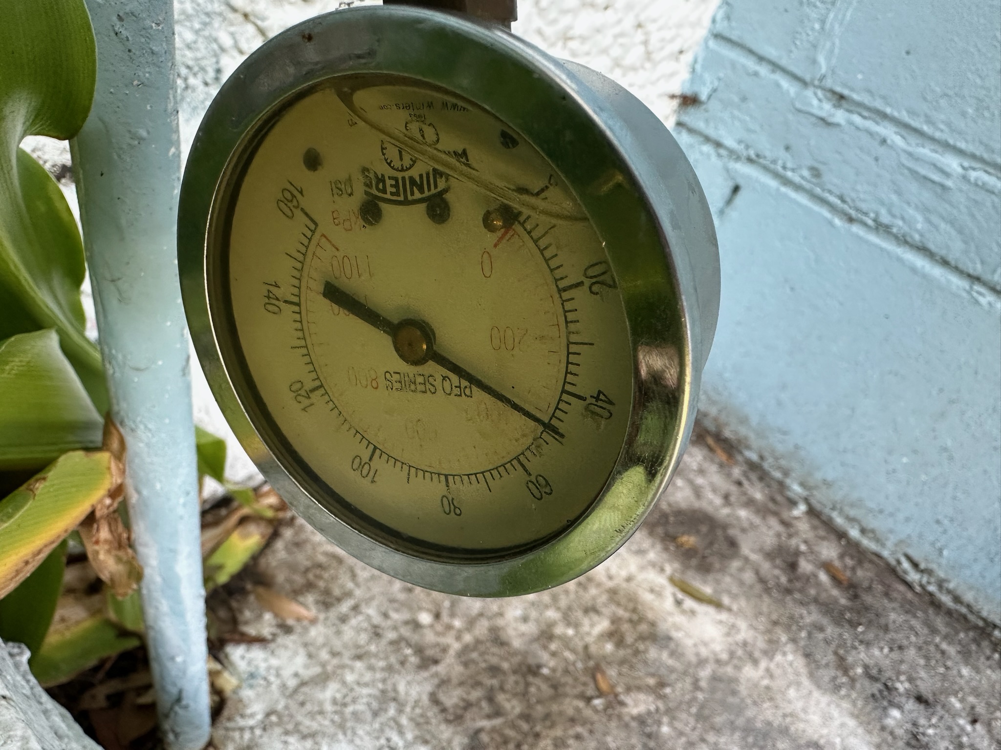 Leak technician checking water pressure in a Clearwater home.