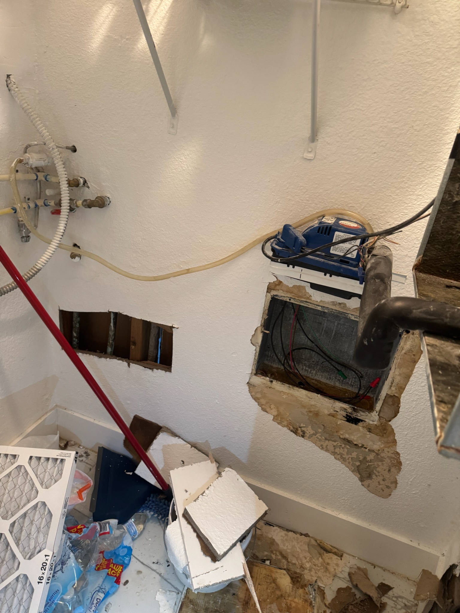 Drywall damage in Madeira Beach laundry room from improper leak detection