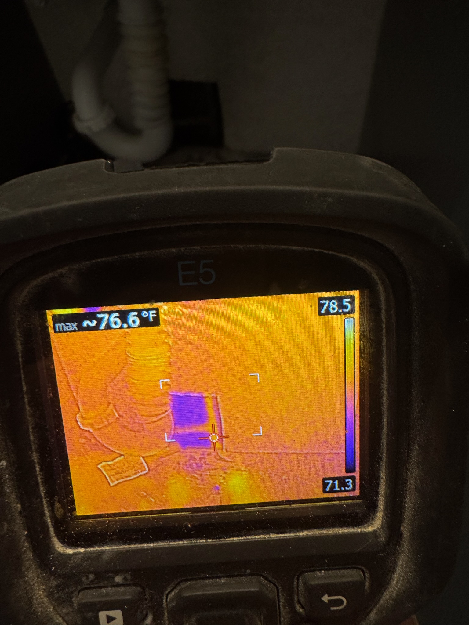 FLIR infrared image showing concentrated moisture inside drywall under vanity in Madeira Beach home