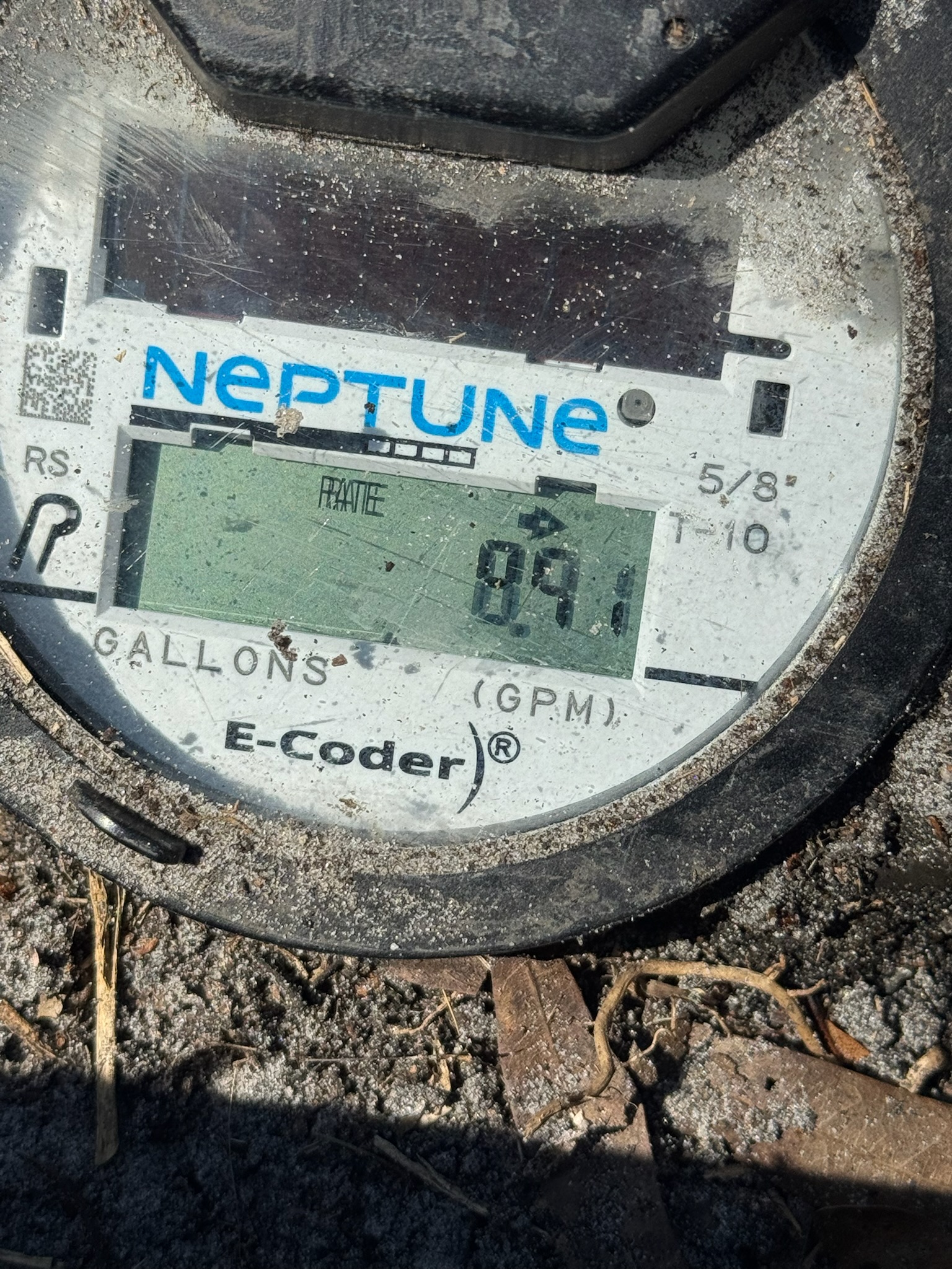 Digital Neptune water meter in Oldsmar showing 8.9 gallons per minute leak rate