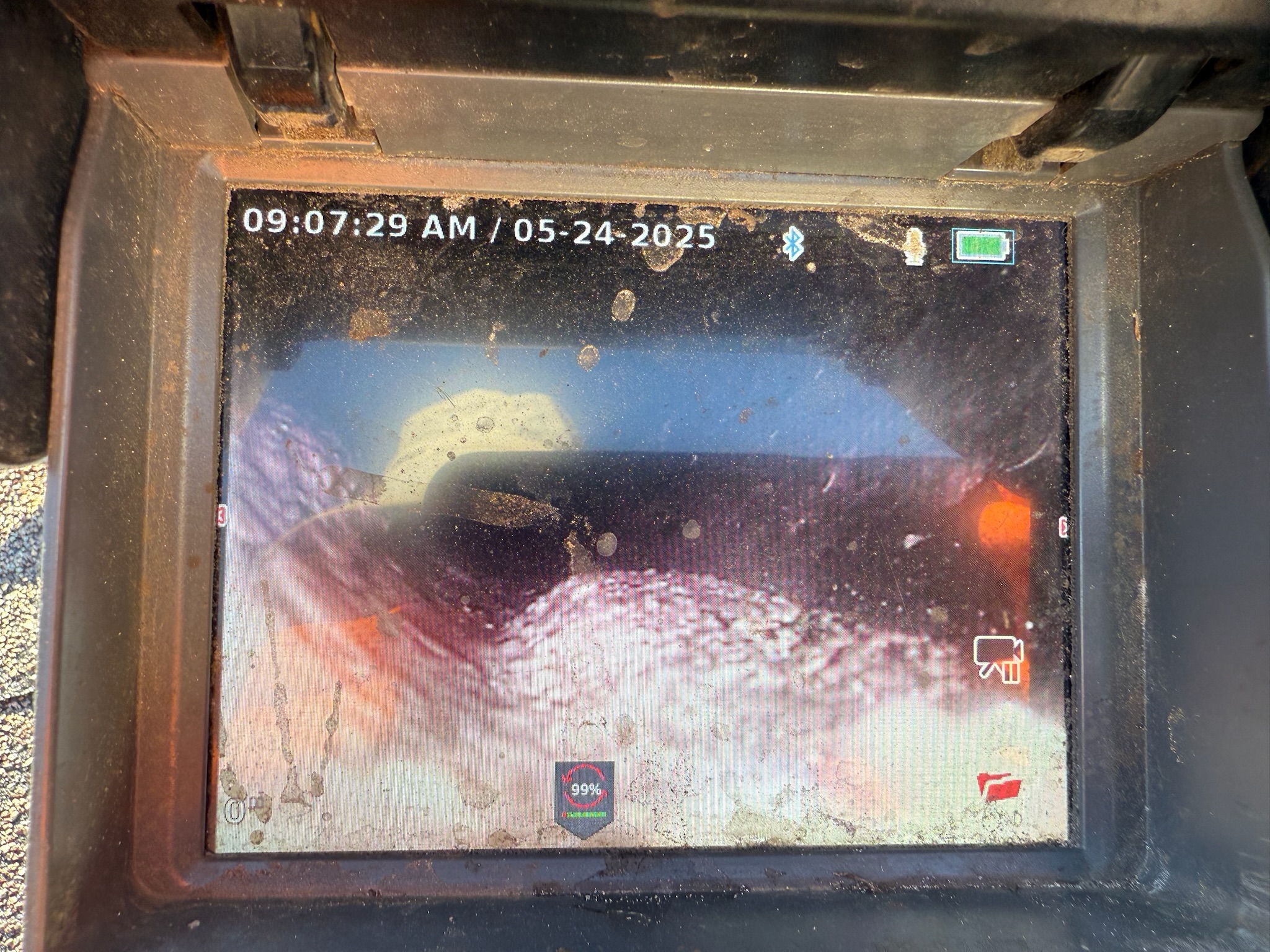 Real-time sewer camera footage showing debris or grout buildup inside Clearwater home’s sewer line