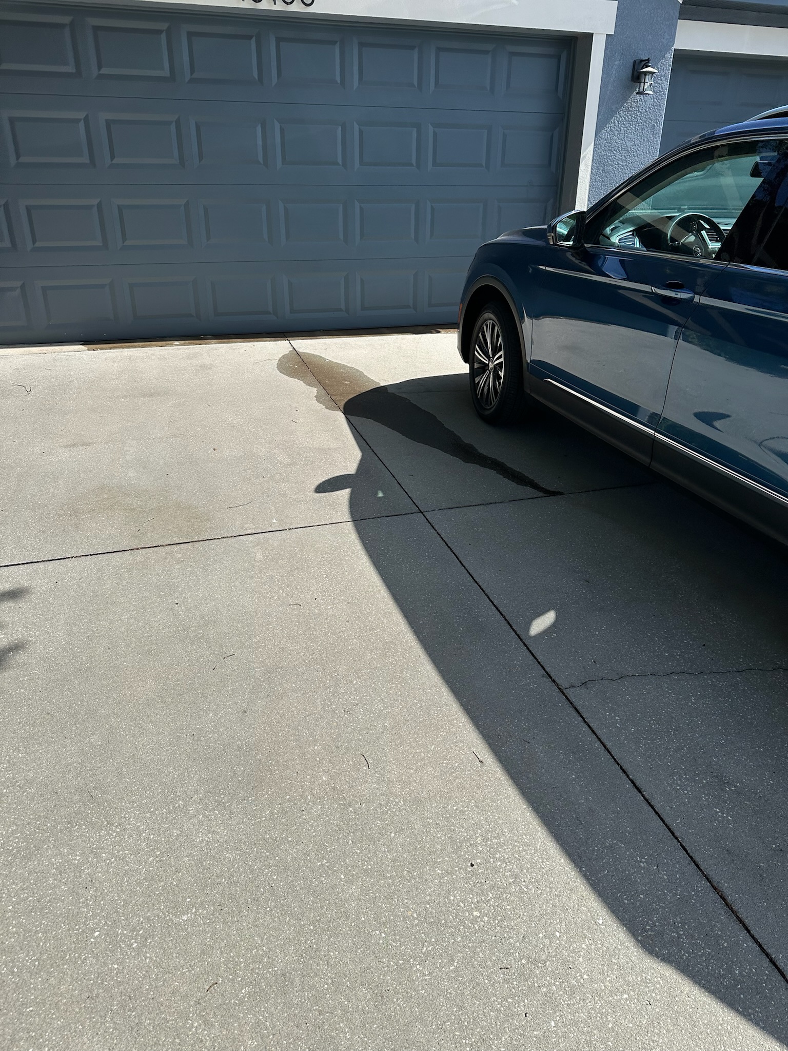 Water leaking from driveway cracks outside Tampa home with high utility bill