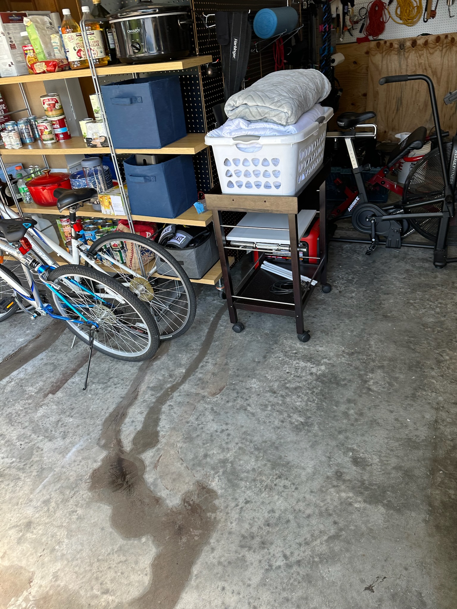 Water leaking from crack and shelving area inside Tampa garage