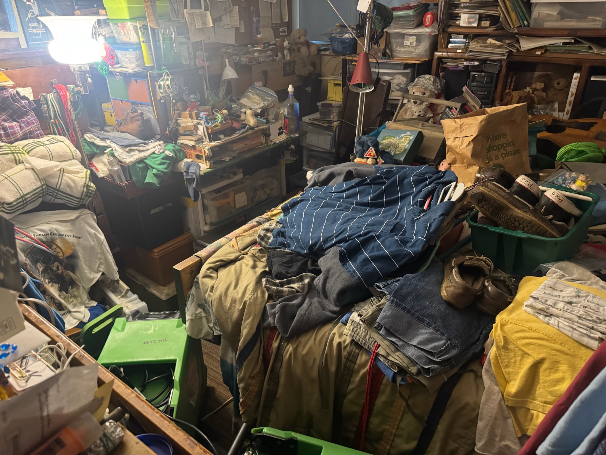 Extreme clutter inside a Clearwater hoarder house where a hidden water leak was detected