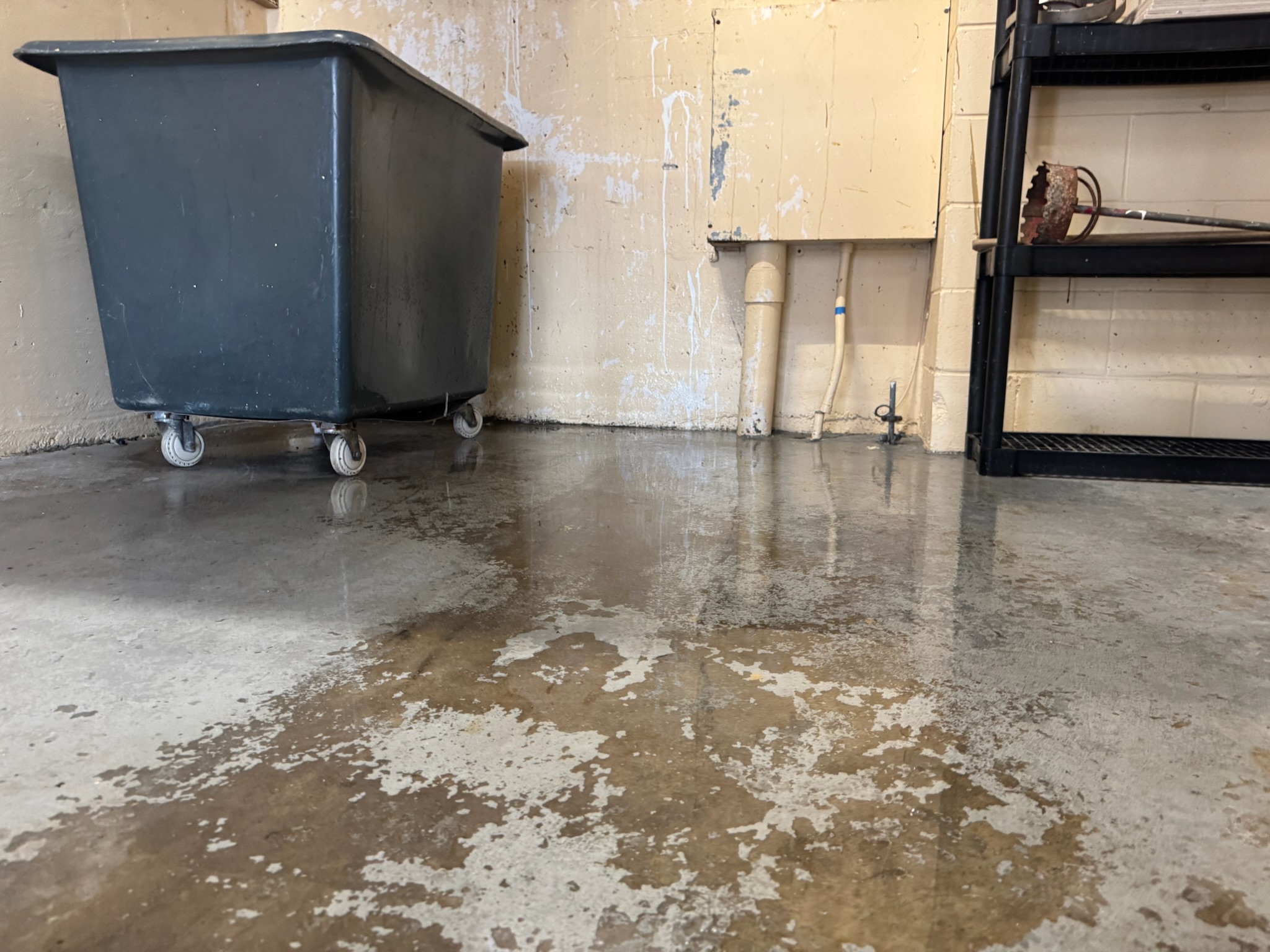 Water leaking from a block wall near an electrical panel in a Clearwater Beach condo building