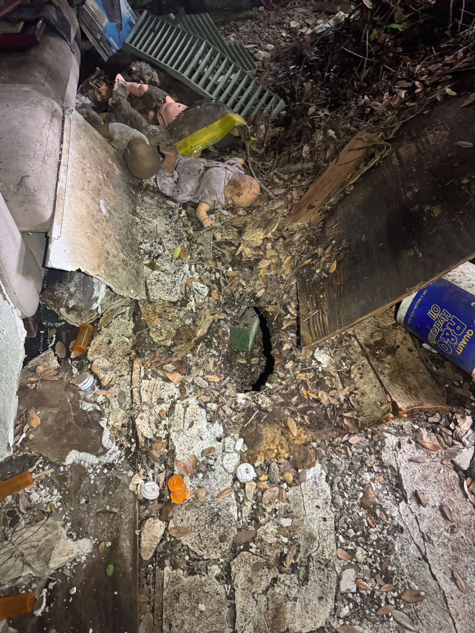 Chilling scene with pill bottles and floor hole