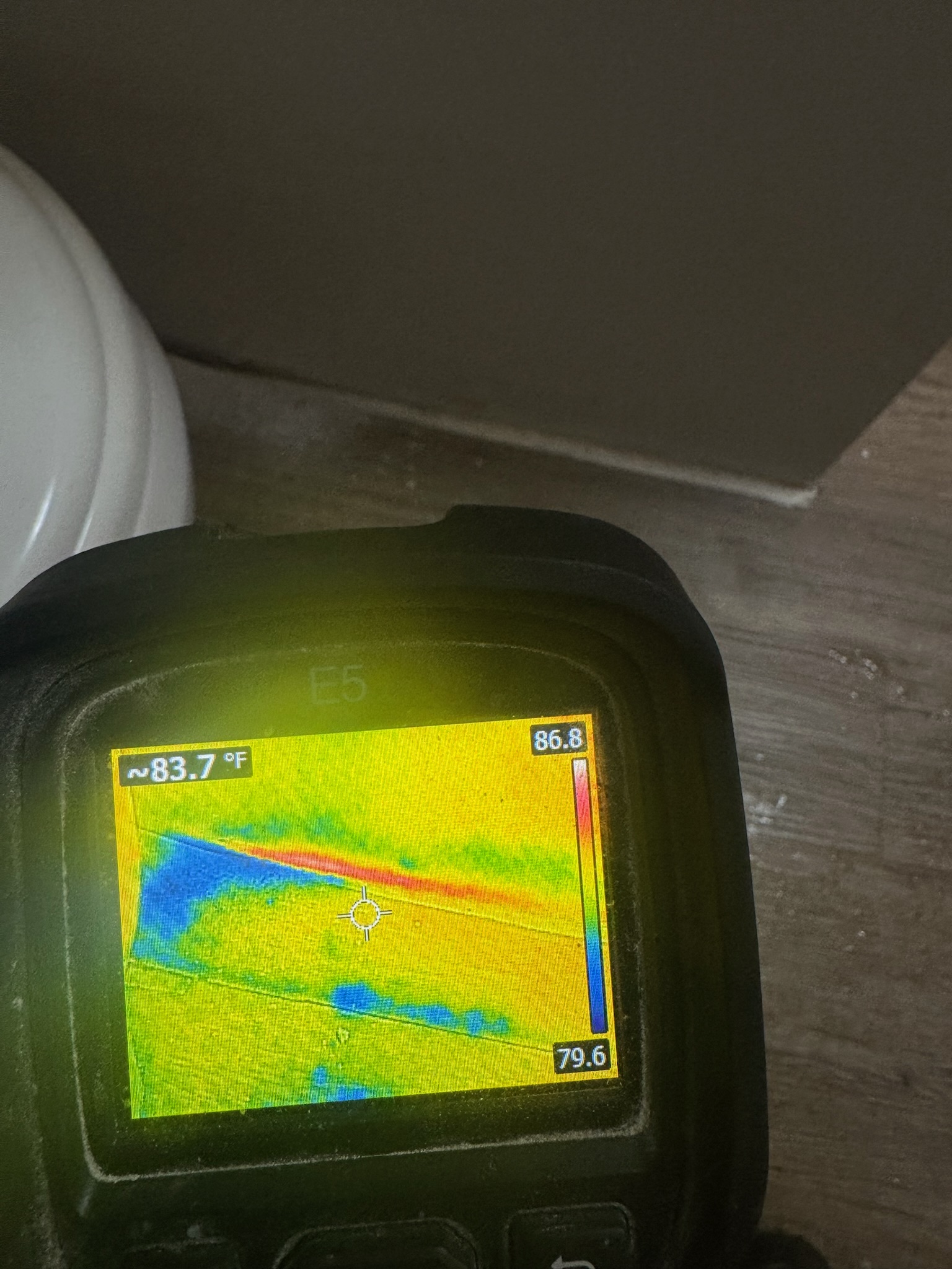 Infrared scan near toilet Infrared camera detects water leak near toilet on wood floor in St. Petersburg home