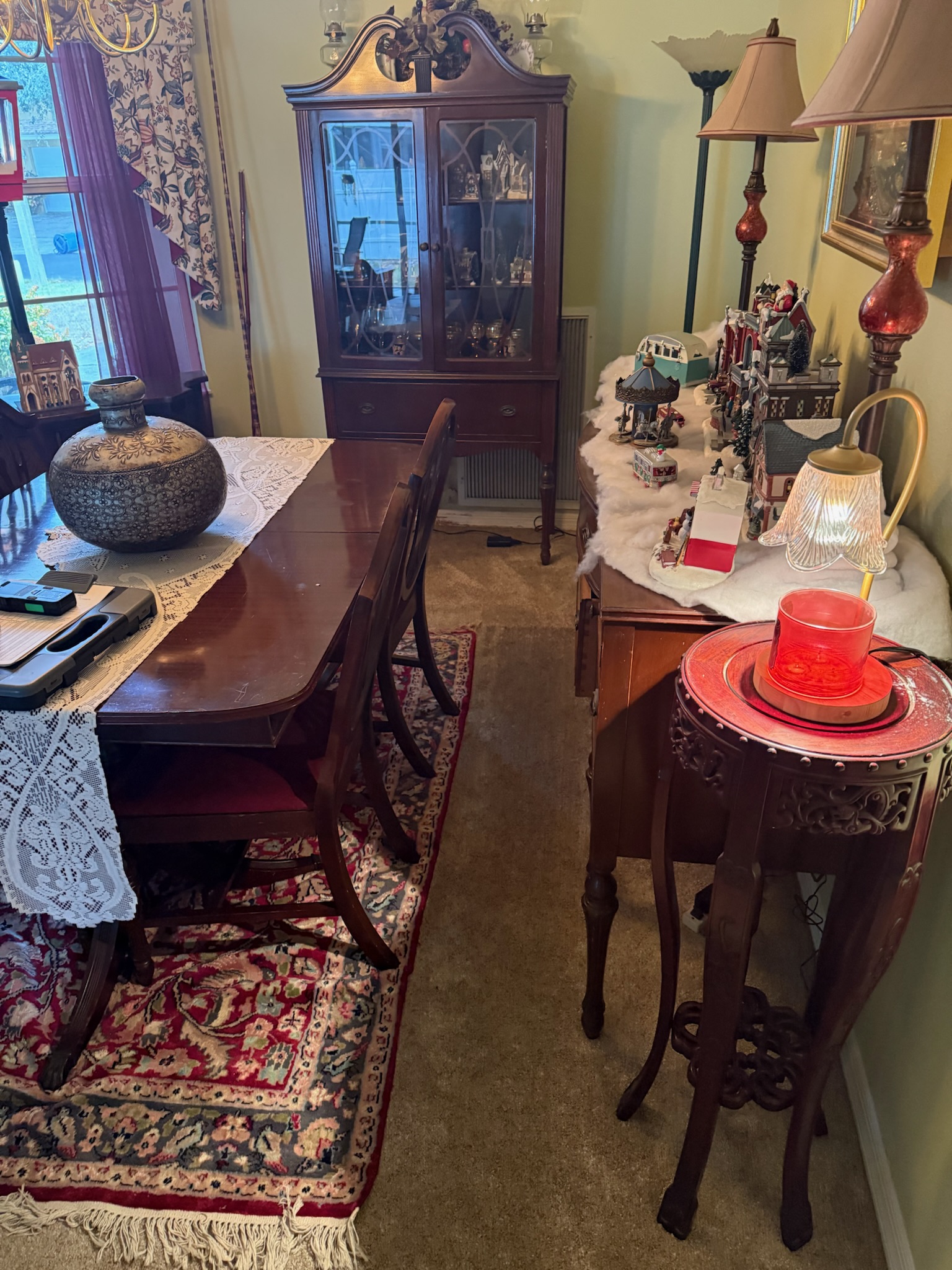 Hidden water leak symptoms in a dining room with brown carpet that feels squishy underfoot despite no visible damage