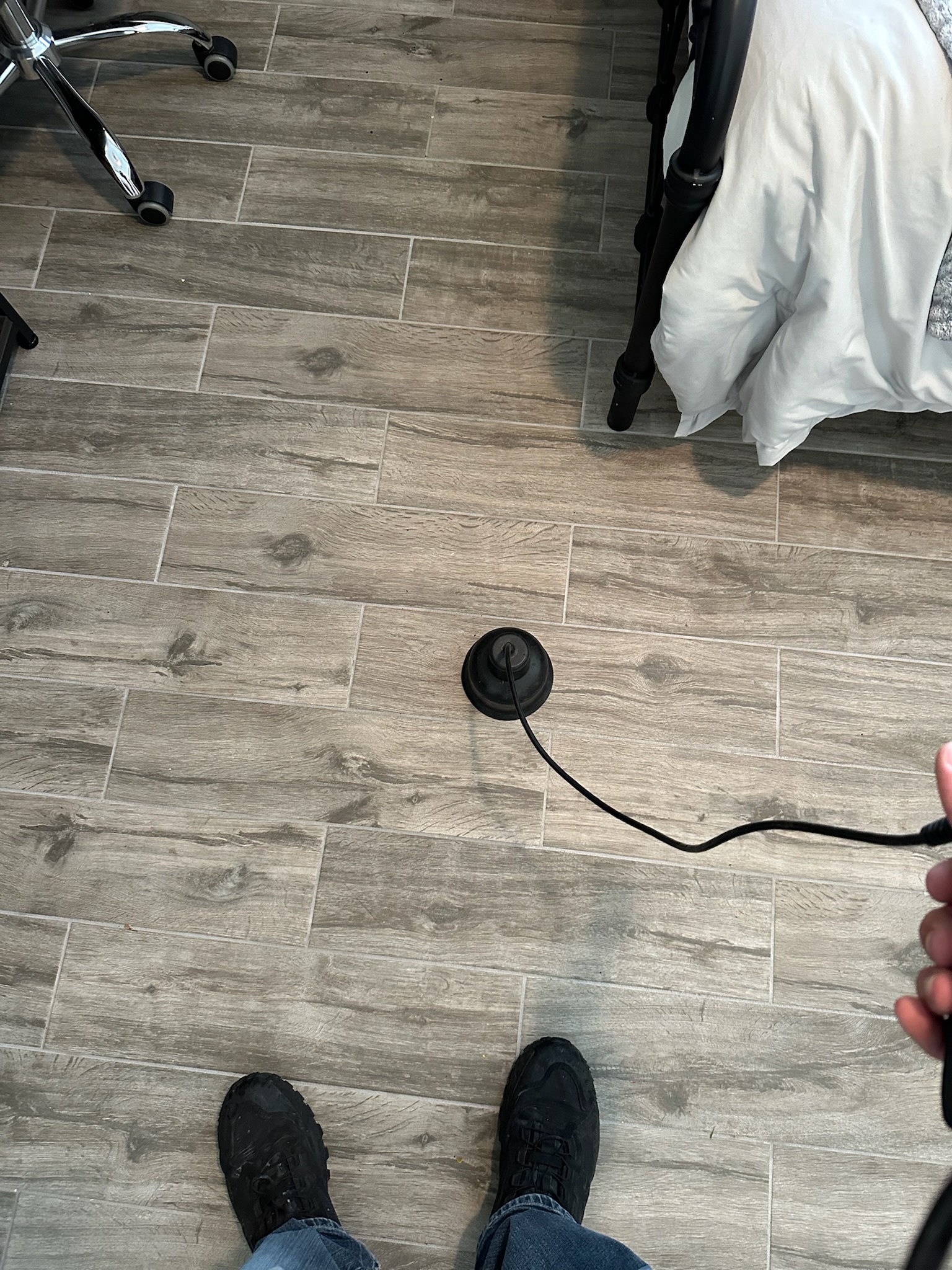 Acoustic leak detection equipment used to pinpoint slab leak during high water bill investigation in St. Petersburg home