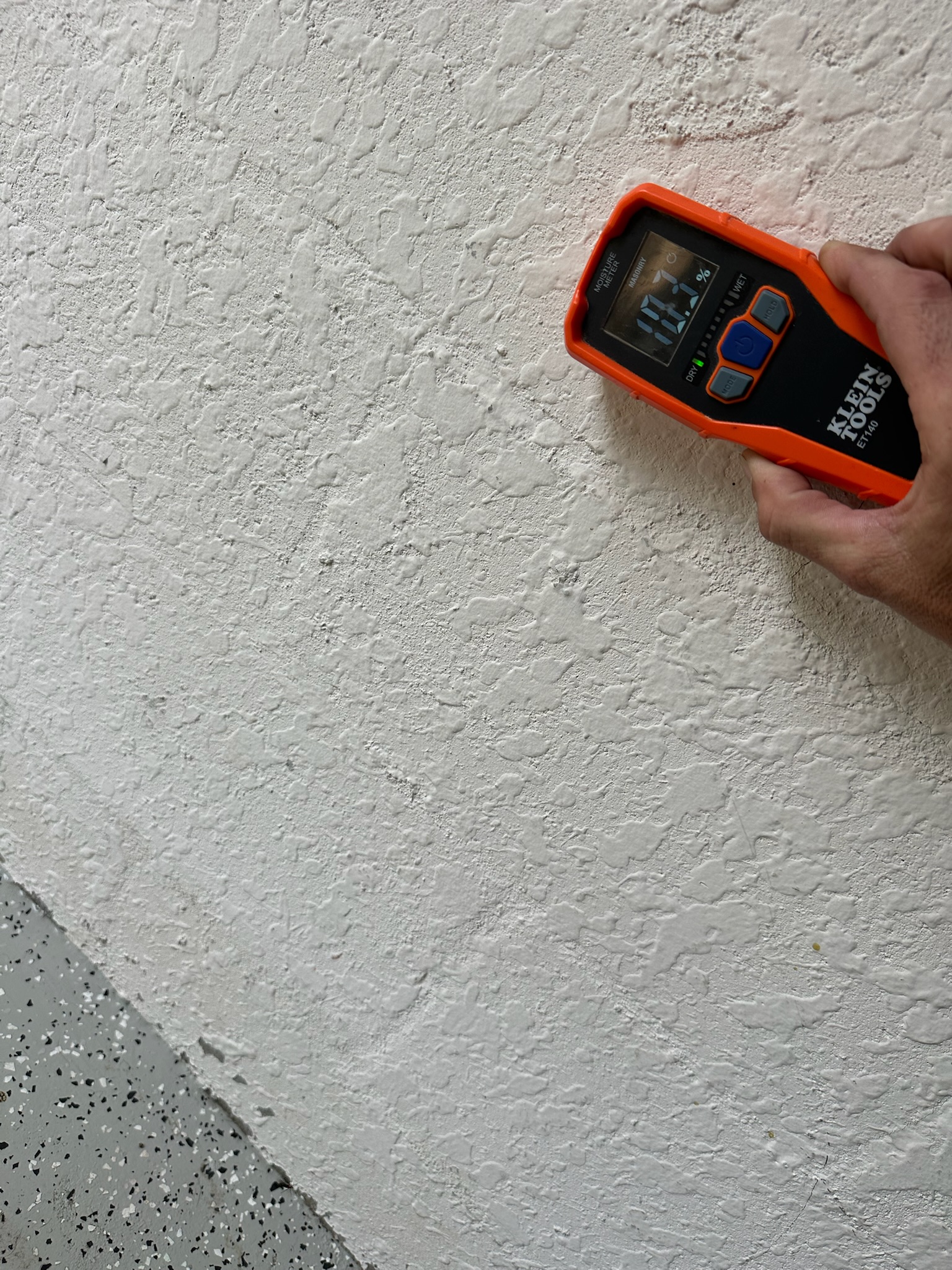 Moisture meter testing block wall in Largo FL