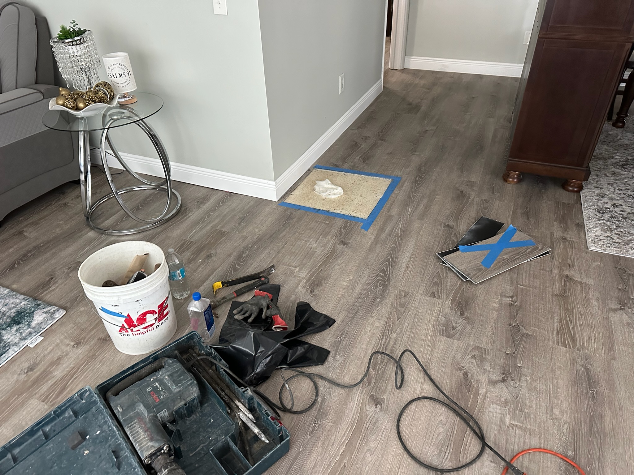 Bosch jackhammer and tools prepared for slab leak access in Clearwater home after high water bill investigation