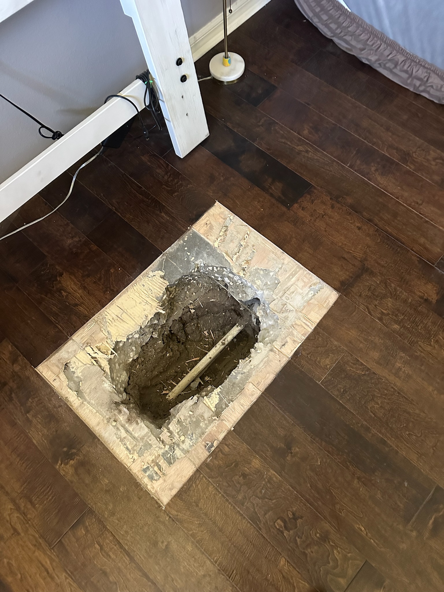 Oldsmar Water Leak Detection - Temporary Clamp on Copper Pipe Leak Temporary clamp installed on a confirmed copper pipe leak under a bedroom slab during an Oldsmar water leak detection job.
