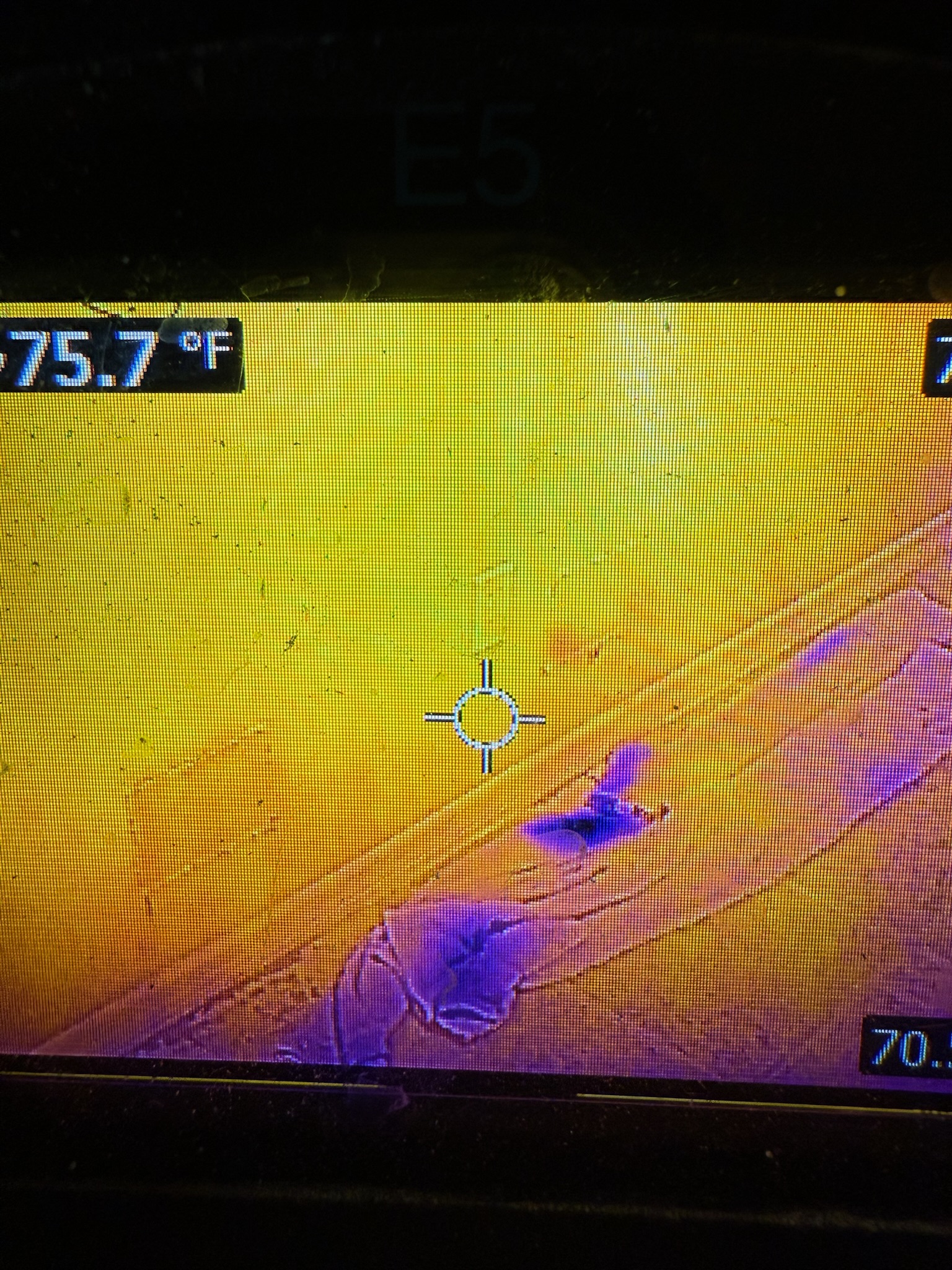 Palm Harbor water leak detection FLIR camera close-up showing dry wall openings and moisture in towels on the floor.