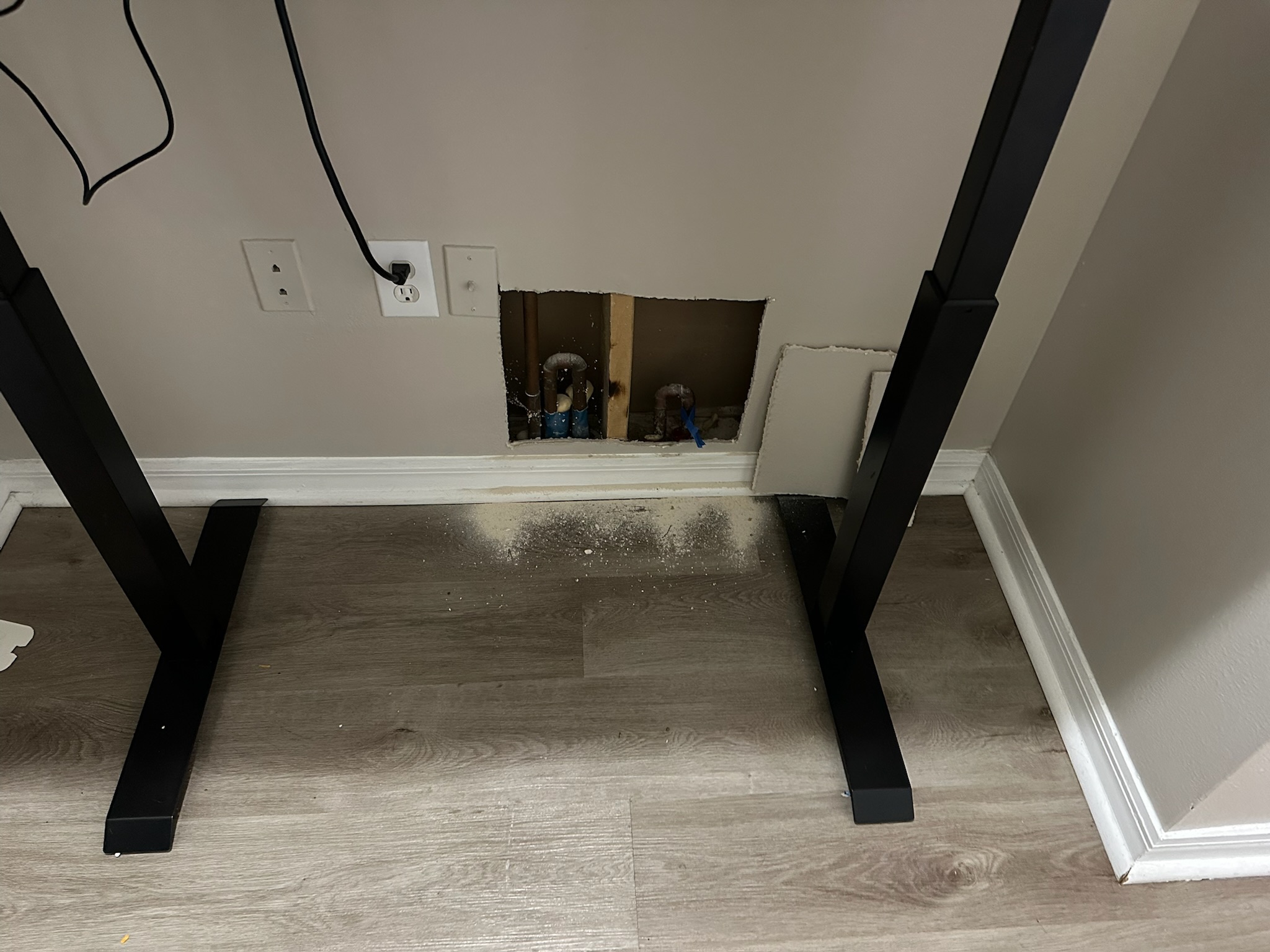 Targeted wall access exposes copper plumbing pipes during St. Petersburg leak detection inspection